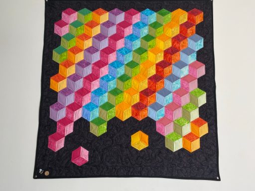Tumbling blocks quilt with bright colours